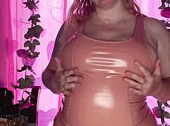 woman teasing in latex dress, showing off curvy body and huge ass