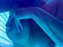 Hey, check out this hot babe playing with pierced nipples in a sauna studio