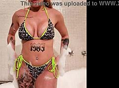 Brenda strips down in the bathtub, getting naked after her bikini tease