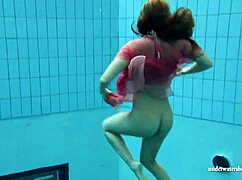 Silvie swims in bikini, reveals hairy pussy.