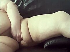 Coolmarina, a mature bbw, plays with her hairy pussy using a homemade dildo