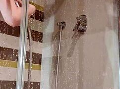 Bitch teases herself in the shower with a dildo, sucking and fucking.