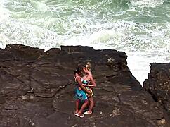 on the rock facing the sea we do a bit of hard cuddles