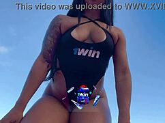 Hey, check out this Latina teen showing off her pierced goods at the beach!