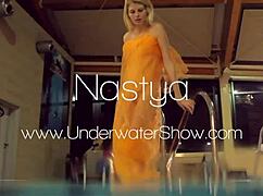 Nastya strips her clothes and shows naked hot body in the pool