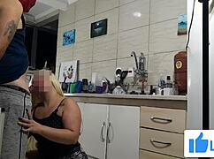 Hot stepmom in the kitchen gives a sloppy blowjob to her lover.