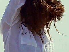 Sexy brunette milf dances and strips outdoors