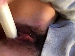 Japanese girl with hairy pussy masturbates close up, squirting during massage