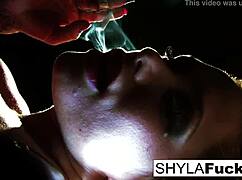 Shyla Stylez shows off big tits and ass in solo fetish smoking scene.