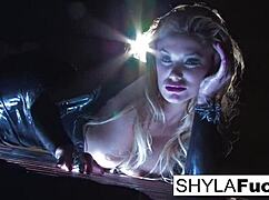 Shyla Stylez shows off big tits and ass in solo fetish smoking scene.
