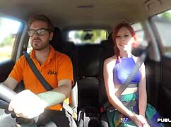 redhead brit subtly rides driving instructor in public car lesson