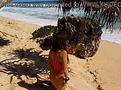 My sandy ass with red butt plug at paradise beach