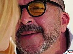 A blonde babe gets banged by old guys in a threesome