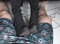 Resting her boots on my cock and balls 😏