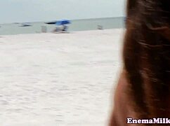 Bizarre enema fetish babes enjoy rimming on the beach