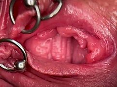 really close up on my pierced clit getting wet and peeing inside pussy.