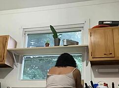 Mature latina milf enjoys simple task of doing dishes in her home