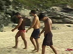 two big hard dicked dudes mouth fucking tanned twink on beach 😏