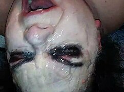 Ms. TL demonstrates throat techniques with toys and dildos in a messy setup