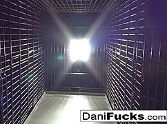 sexy dani daniels acts like a bitch in the cage, masturbating her pussy.