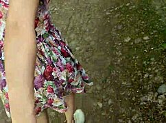 public blowjob from a stunning beauty in a dress showing off her skills