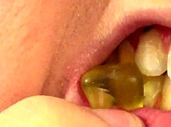 i'm watching fifi foxx eat gummy bears up close with mouth vore