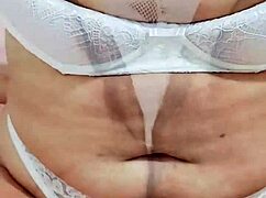 Pretty amateur in lingerie sensualizing with her beautiful hairy pussy and brown eyes! Cute tits on display!