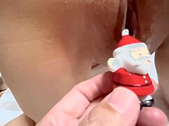 santa claus plays with a wet pussy in this couple's homemade scene