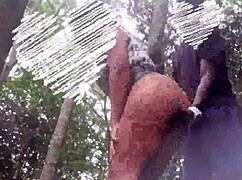 Milf couple fucks outdoors in forest