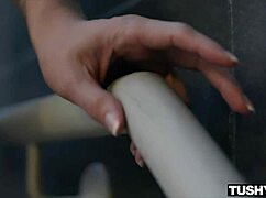 Curvy brunette stretches her tight muscles wide open in a flexible routine