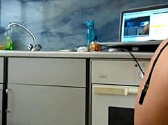 Topless in garage, she spreads big ass for webcam masturbation.