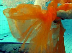 Nastya strips bare and flaunts hot naked body in pool