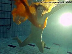 Nastya strips bare and flaunts hot naked body in pool