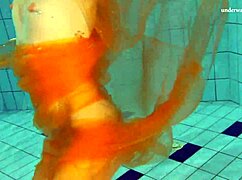 Nastya strips bare and flaunts hot naked body in pool