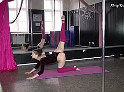 russian blackhaired gymnast performs amateur acrobatic moves