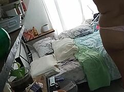 curvy mexican milf caught on hidden cam cleaning her room in part 1. voyeur thrill awaits!