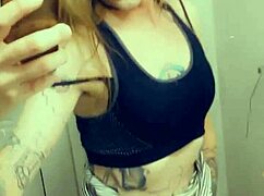 Pretty transsexual in miniskirt and stockings shows off her small cock while masturbating