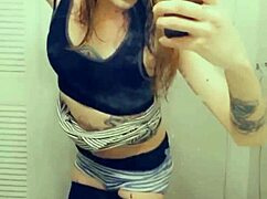 Pretty transsexual in miniskirt and stockings shows off her small cock while masturbating