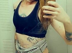 Pretty transsexual in miniskirt and stockings shows off her small cock while masturbating