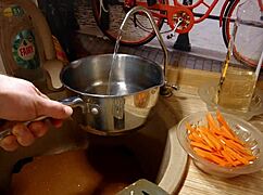 Naked Gay Chef Prepares Rice Noodle with Chicken and Vegetables in Kitchen