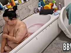creepy guy spies on bbw milf washing huge tits in bath
