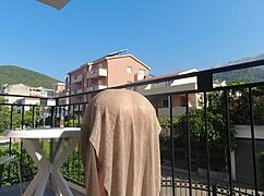 nude on a public balcony, wanna flash my wet boobs overlooking the road?