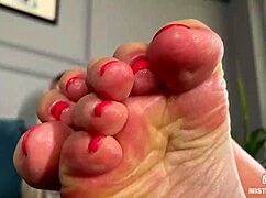 Goddess teases you with pink oily soles and toes, spreading close up