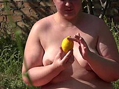 bbw pushes lemon from hairy pussy in outdoor setting