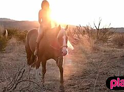 Hey, check this curvy redhead milf showing off big tits while riding a horse outdoors!