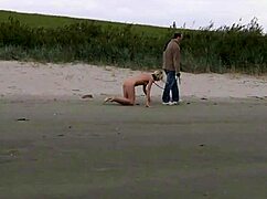 Faithful Slave Follows Master on Leash