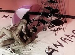 a naughty brunette and her man play with dark oil and fuck doggy style 😈