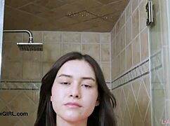 enchanting brunette beauty showers in steamy solo action!
