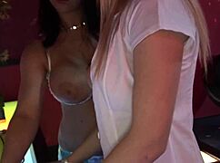 Diana Gold and Kristi Klenot in stockings and heels perform striptease before getting assfucked on stage.