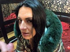 Stepmom gets face-fucked with cumshot on her shiny down-jacket.